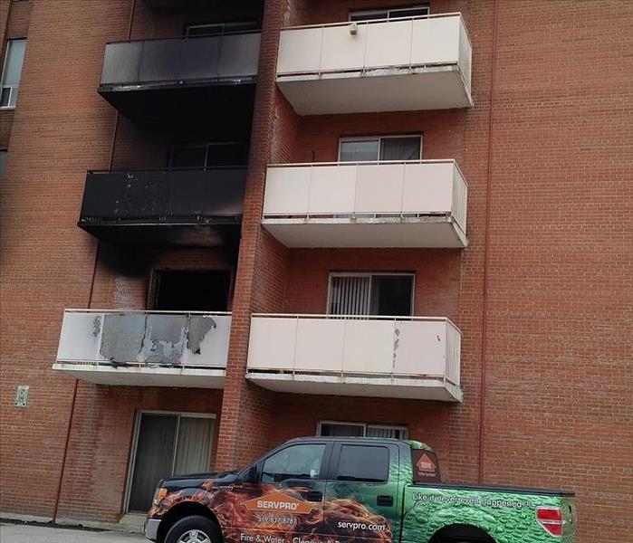 Apartment building with fire damage to the brick and exterior 