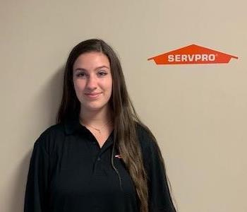 SERVPRO of Guelph Team, girl standing in front of the SERVPRO logo