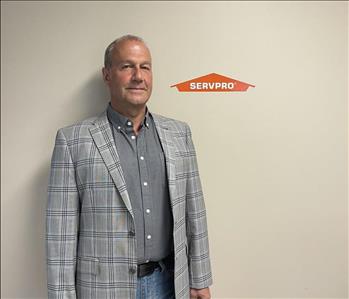 SERVPRO of Guelph Team, man standing in front of the SERVPRO logo